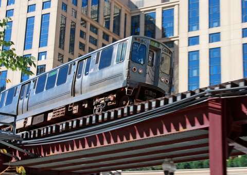 Elevated train passing through a city’s downtown business district