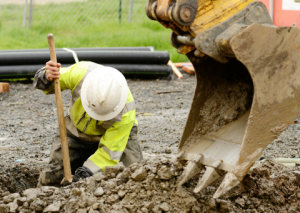 Construction worker digging