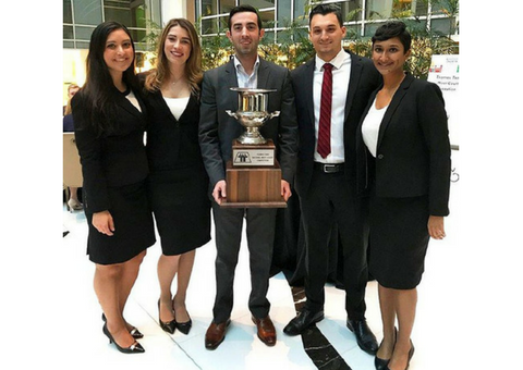 Loyola Moot Court Team holding trophy