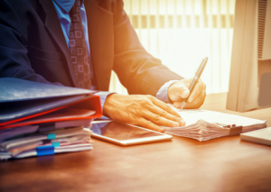 Businessman signing papers