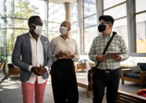 Coworkers with COVID-19 masks