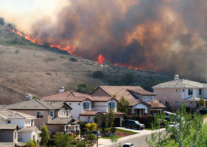 Wildfire on ridge above a neighborhood