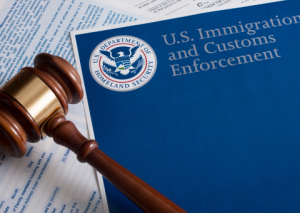 US Immigration and Customer Enforcement paperwork and gavel