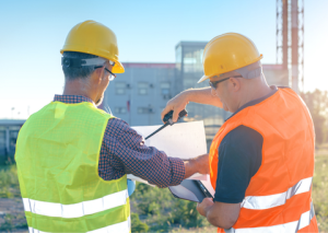 Construction workers looking at blueprints